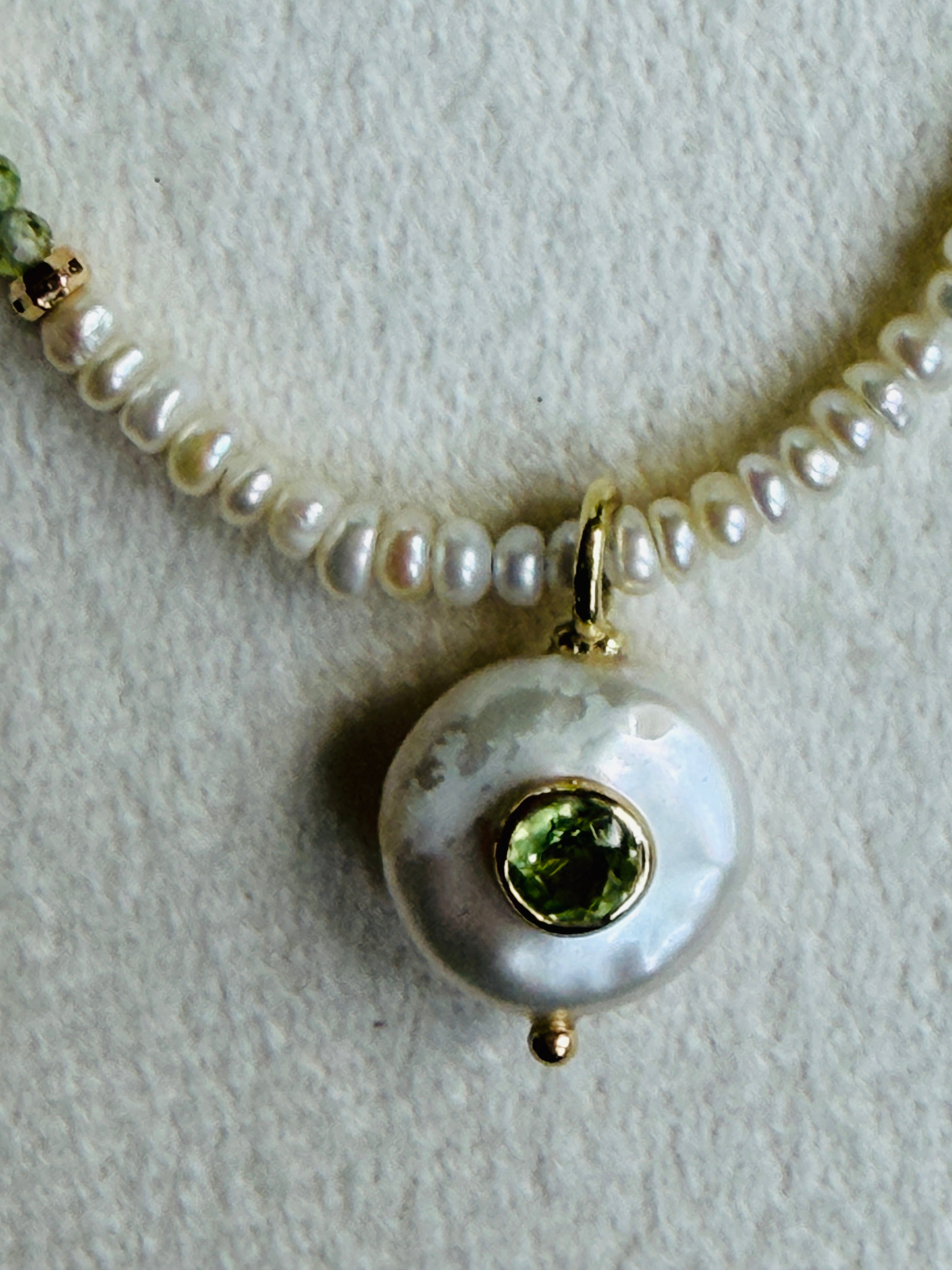 Pearl necklace with coin pearl with inset peridot pendant